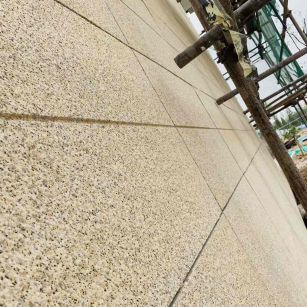 通辽 黄金麻花岗岩荔枝面外墙干挂石材效果示例